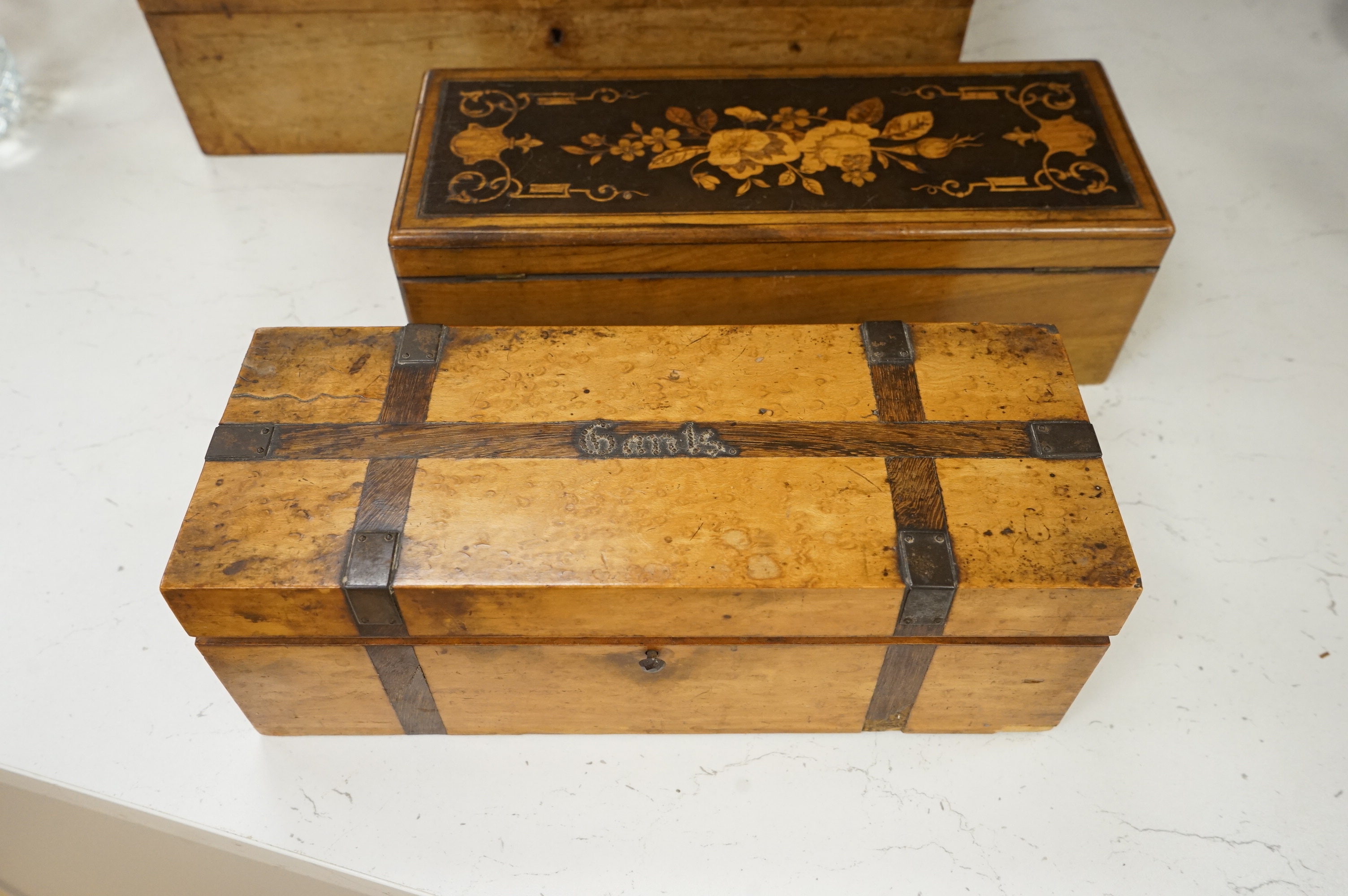 Three boxes comprising a Sorrento ware glove box, a marquetry inlaid slope and a rosewood dressing box, largest 39cm wide